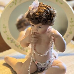 Ashton Drake Porcelain Baby Doll with Pearls and mirror. Is sighed.